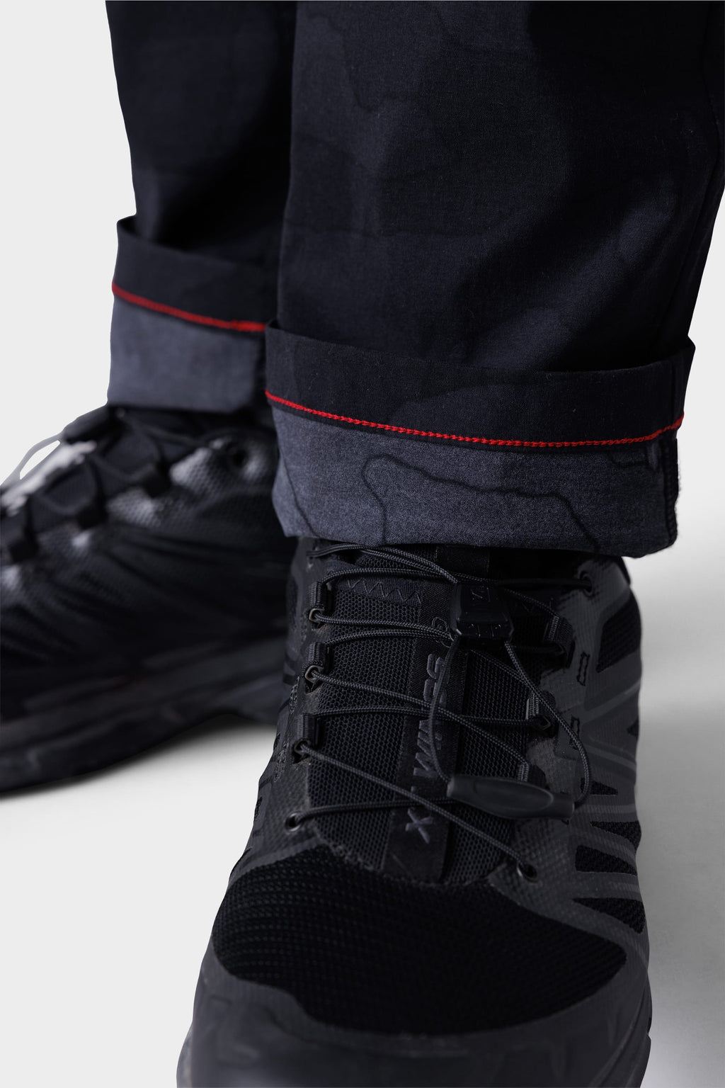 Close-up of 686 Mens Everywhere Featherlight Chino Pant - Slim Fit, paired with black shoes—lightweight design makes these chinos ideal for summer wardrobe updates and warm weather adventures.