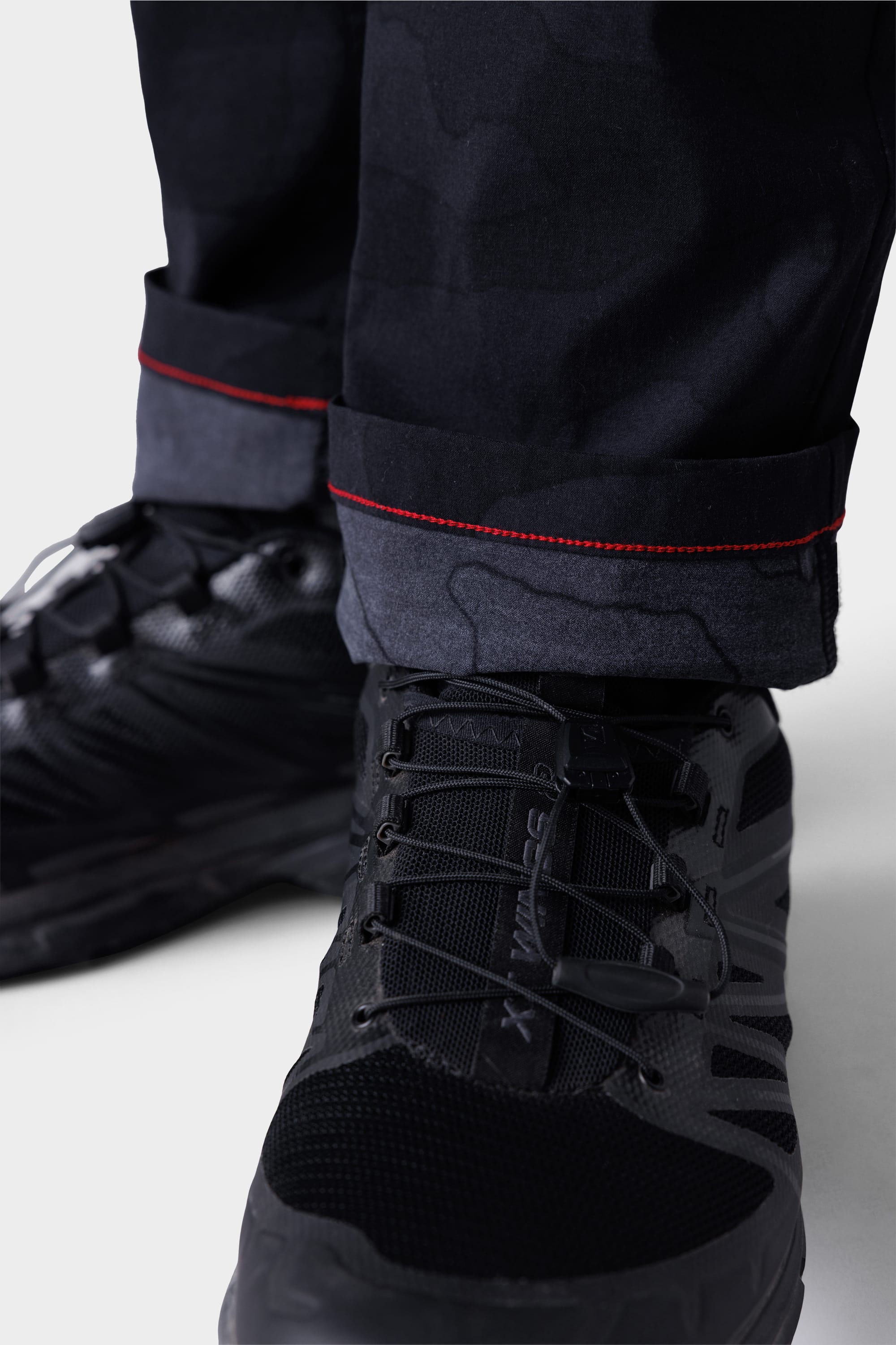 Close-up of 686 Mens Everywhere Featherlight Chino Pant - Slim Fit, paired with black shoes—lightweight design makes these chinos ideal for summer wardrobe updates and warm weather adventures.