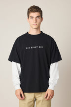 A man posing for a picture in the 686 Wordmark Relaxed 2fer LS Tee by 686.