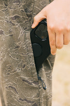 A person with a phone in their pocket, wearing 686 Everywhere® Pant - Slim Fit from 686.