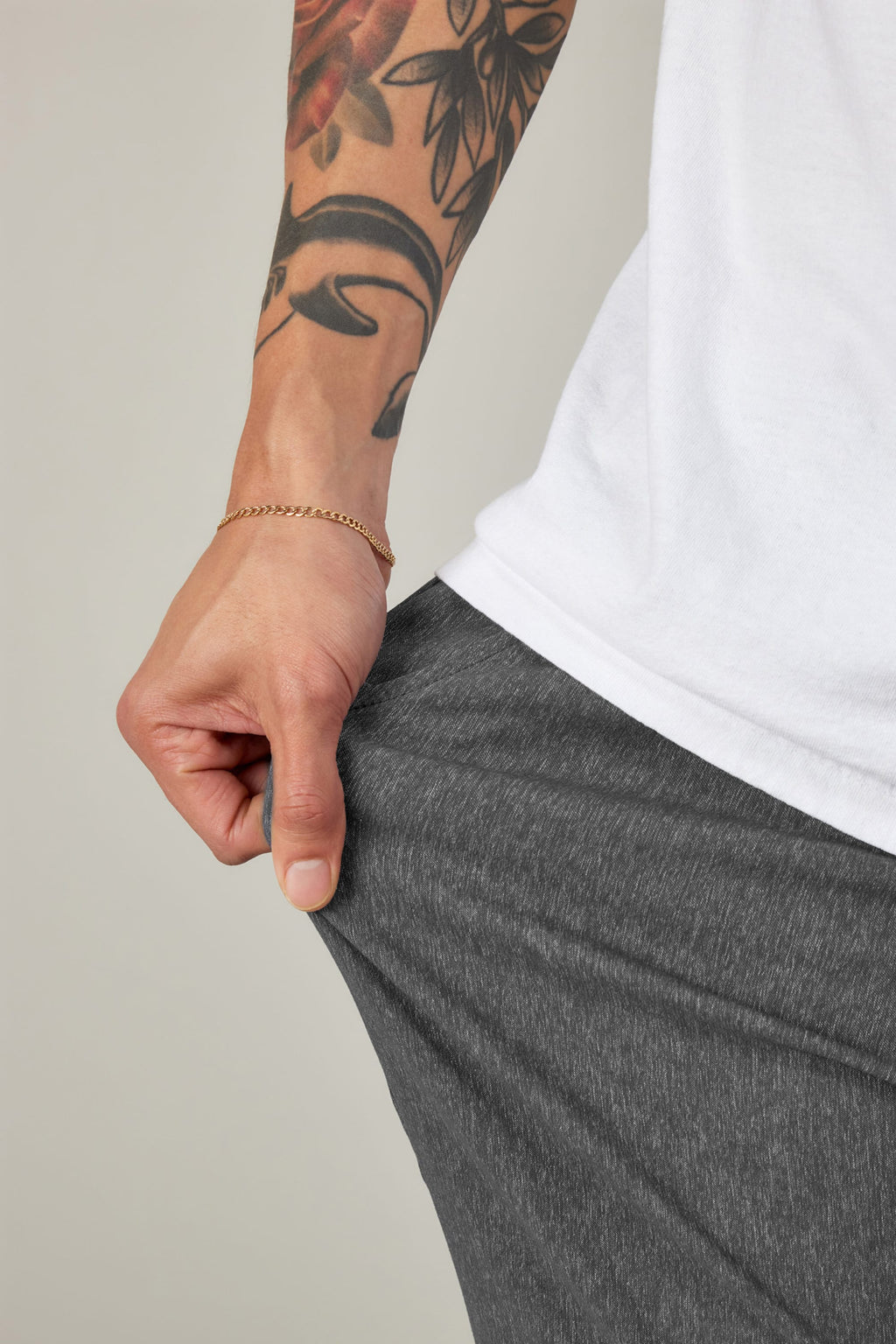 A person with arm tattoos wearing 686 Everywhere® Pant - Relaxed Fit by 686.