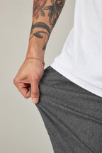 A person with arm tattoos wearing 686 Everywhere® Pant - Relaxed Fit by 686.