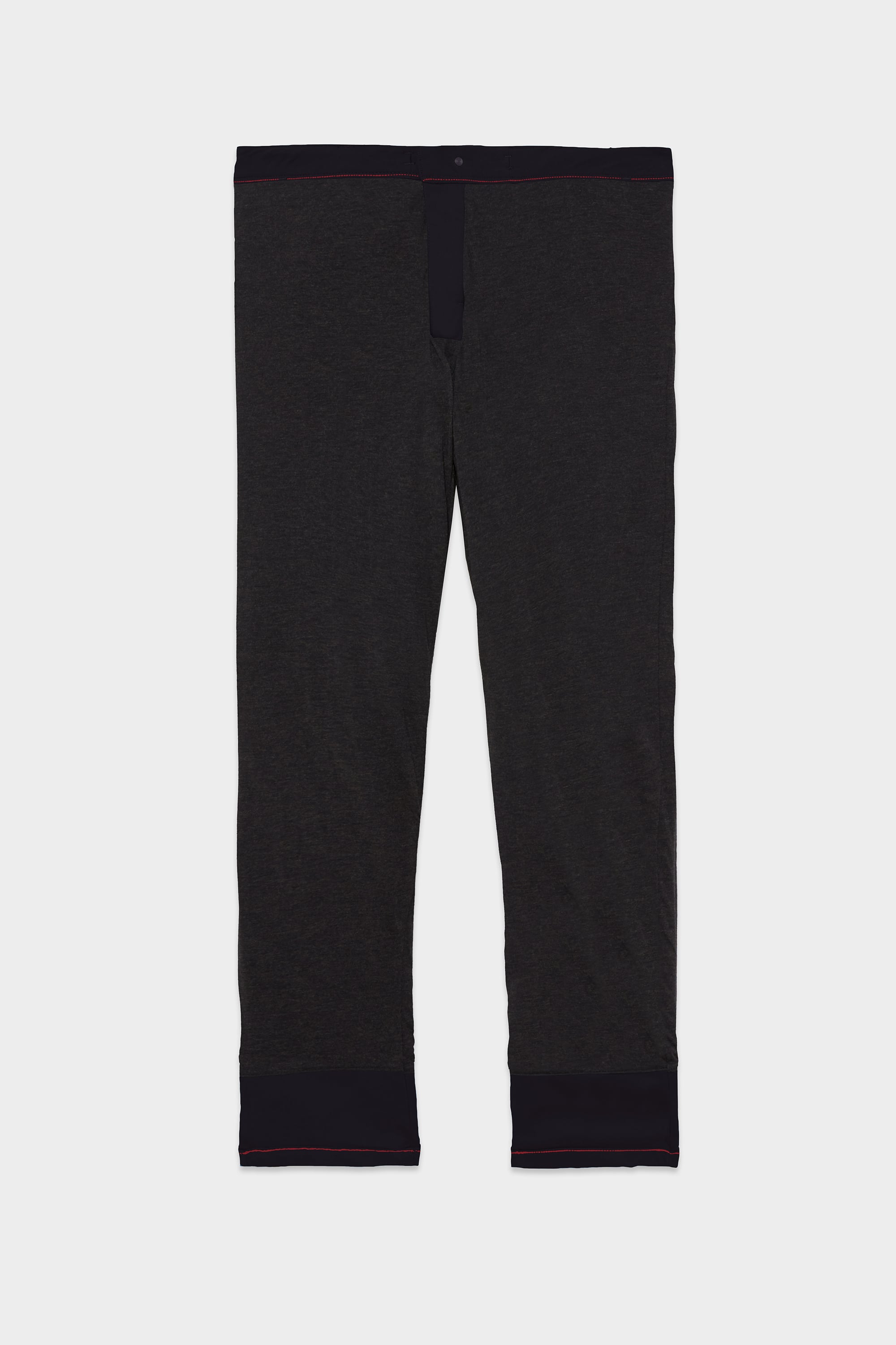 The 686 Men's Everywhere® Merino-Lined Pant - Relaxed Fit by 686 features a dark gray color with a black waistband and cuffs, ideal for layering under your winter jacket.