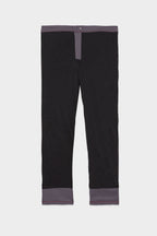 The 686 Men's Everywhere® Merino-Lined Pant - Slim Fit, shown flat on a white background with black fabric and a dark gray waistband, fly, and cuffs, keeps you warm and dry in colder weather.
