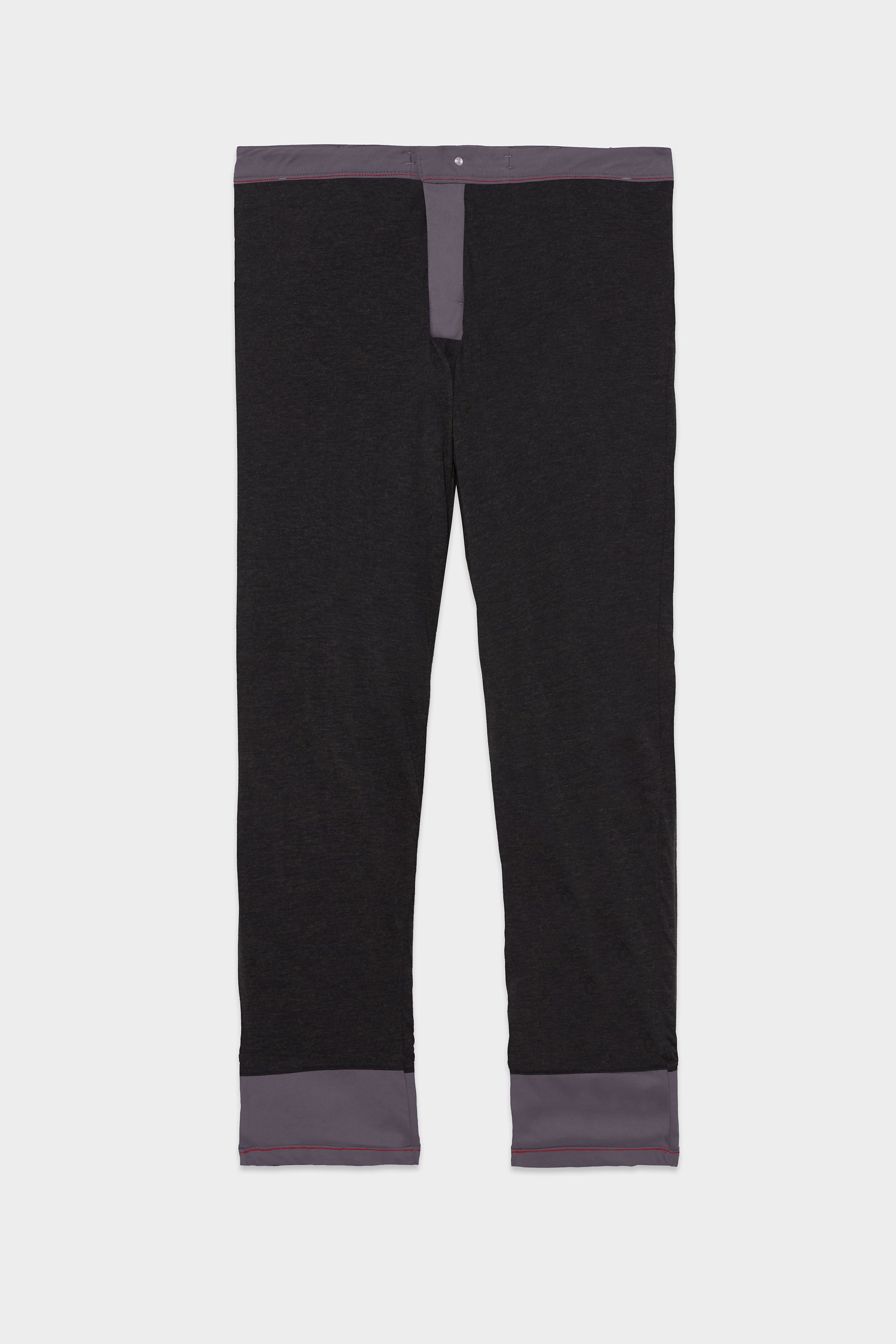 The 686 Men's Everywhere® Merino-Lined Pant - Relaxed Fit features black straight legs with gray cuffs, waistband, and fly—perfect for pairing with your favorite winter jacket for a cozy cold-weather ensemble.