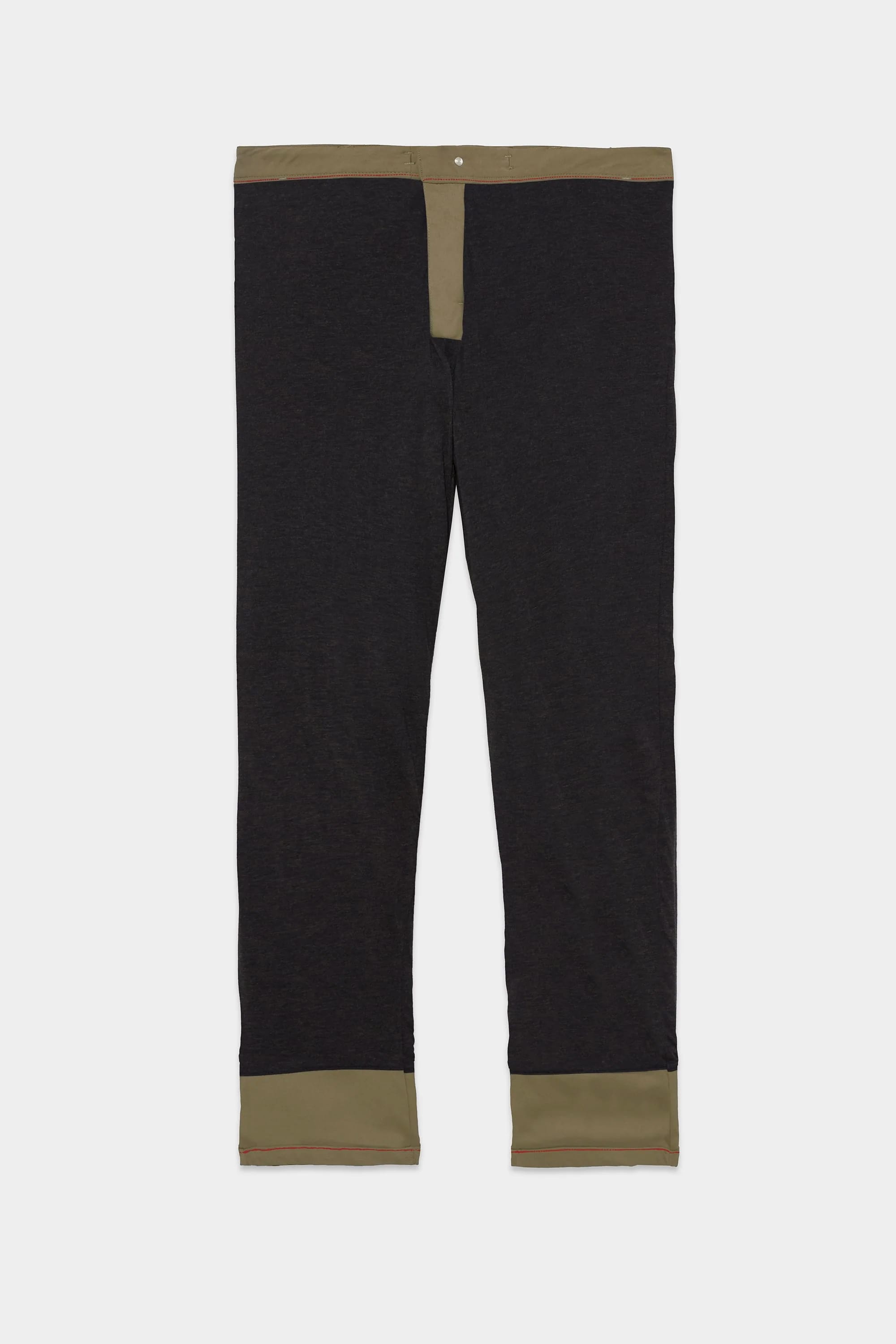 The 686 Men's Everywhere® Merino-Lined Pant - Slim Fit, in black with olive green accents on the waistband, fly, and cuffs, is designed to keep you warm and dry in colder conditions, shown laid flat on a white background.
