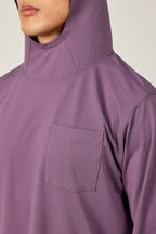 A person wears the 686 Mens Lets Go Tech Hoody in light purple, showcasing its lightweight, breathable design with a chest pocket. Only the lower face and upper torso are visible, emphasizing this 686 hoody’s ideal sun protection.