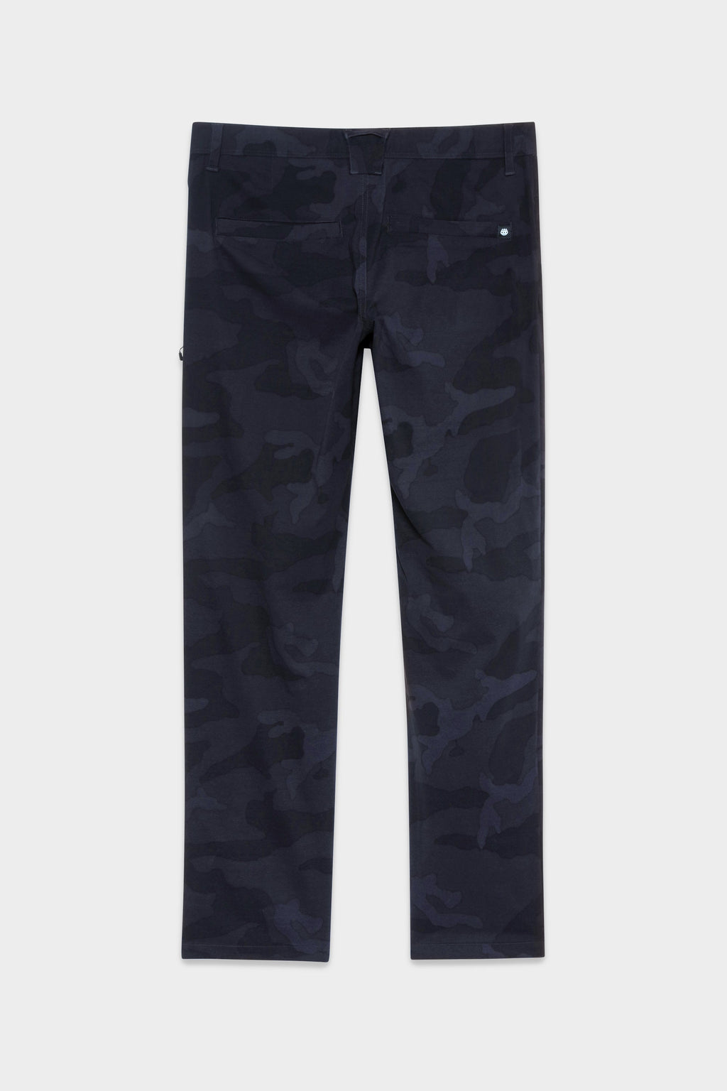 The 686 Mens Everywhere Featherlight Chino Pant – Slim Fit features a lightweight, dark blue and black camo design, ideal for warm weather adventures. Displayed flat on a white background.