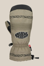 The 686 Lander™ Mitt by 686 is a khaki waterproof mitt with black leather accents, black tribal embroidery, “989” on the front, light insulation, elastic wrist, red tag, adjustable cuff drawstring, and Soundtouch technology.