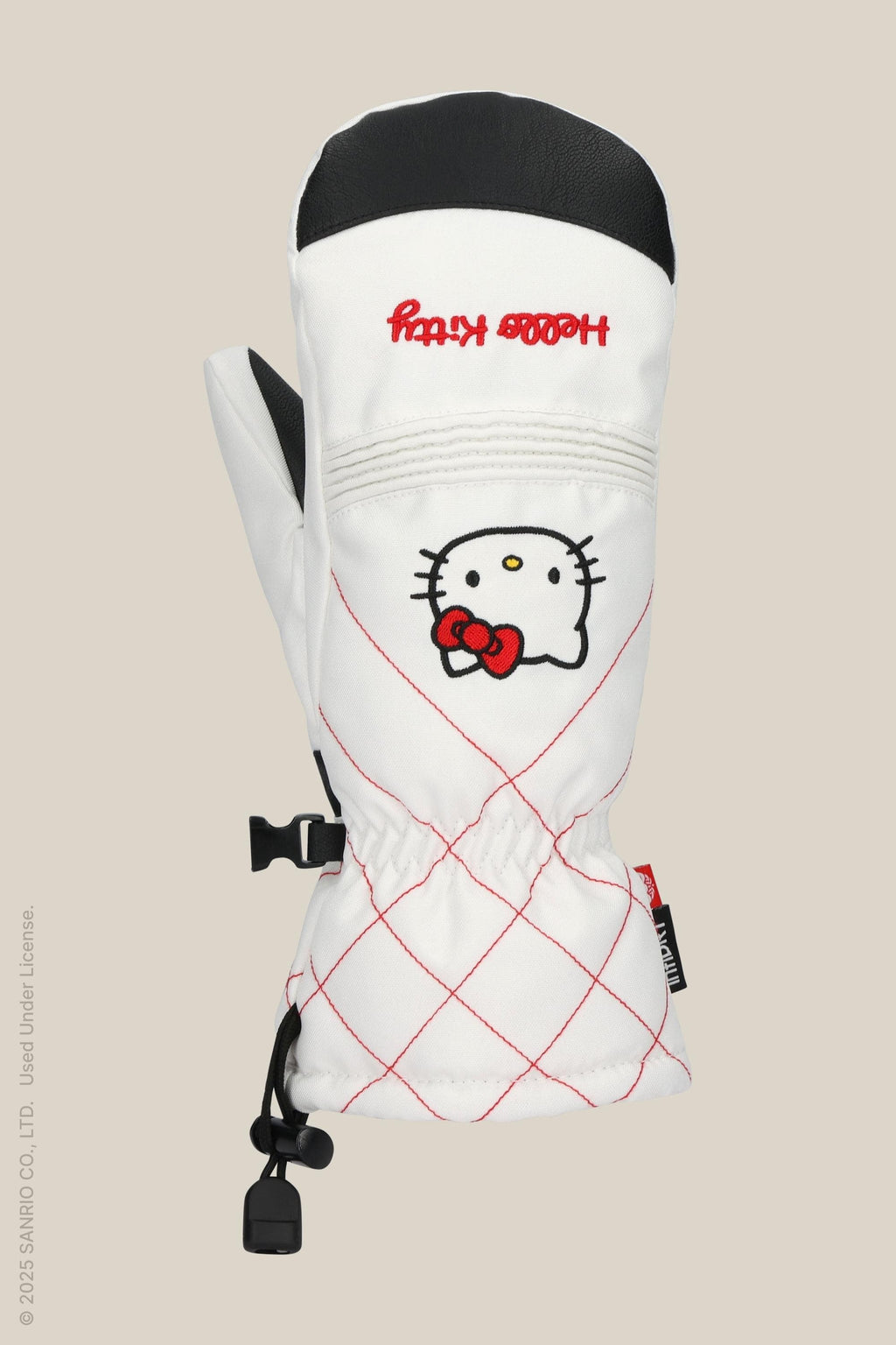 The 686 Women's Jubilee™ Mitt by 686 is a white waterproof mitten with light insulation, red stitching, Hello Kitty face and red bow on back. It has a black thumb grip, drawstring wrist, and playful decorative red text.