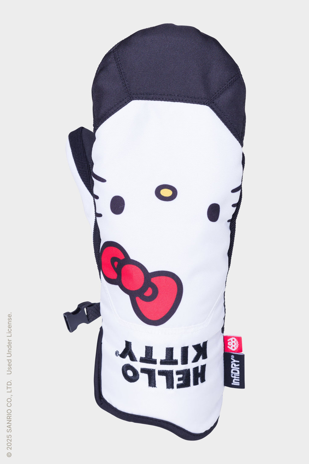The 686 Womens Revel Mitt by 686 is a white and black insulated mitt featuring Hello Kitty’s face, red bow, bold “HELLO KITTY” text, and a small red logo tag on the bottom right side.