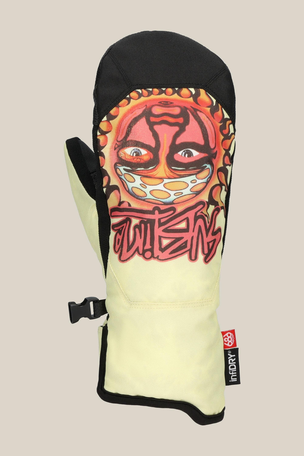 The 686 Womens Revel Mitt by 686 features a yellow and black insulated design with a vibrant graffiti-style face, bold red lettering, black adjustable strap, waterproof materials, and a small thirtytwo tag.