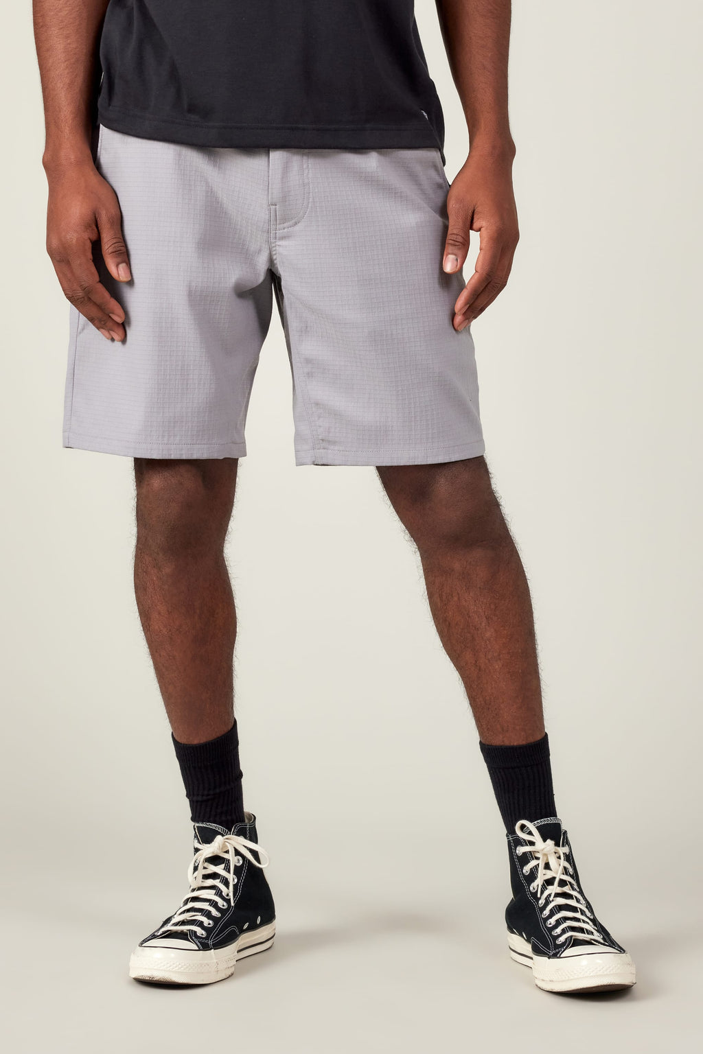A person wears 686 Men's Everywhere® Ripstop Short in light gray, paired with a black tee, black crew socks, and black high-top sneakers with white laces. Only the lower body is shown against a neutral background.
