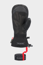 The 686 Men's GORE-TEX Leather Linear™ Mitt features black insulation, a leather palm, fabric cuff, adjustable wrist strap with red pull tab, and 686 branding on the labels and elastic band below.