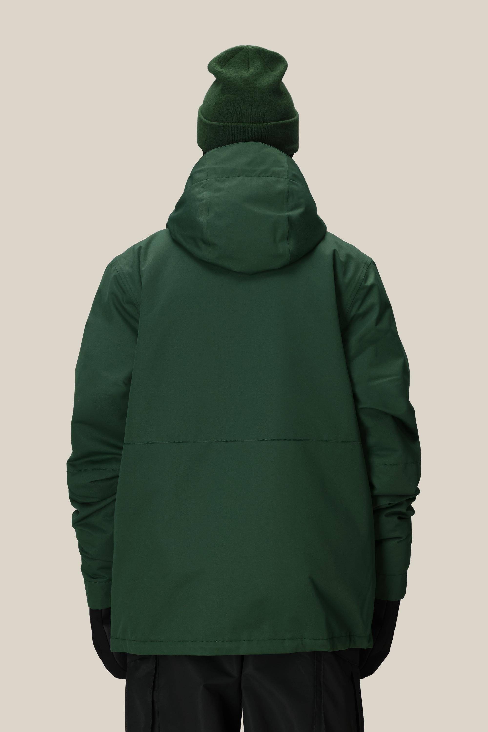 A person is shown from the back wearing the 686 Men's Foundation™ Insulated Jacket by 686 along with a matching green beanie and black gloves against a plain beige background.