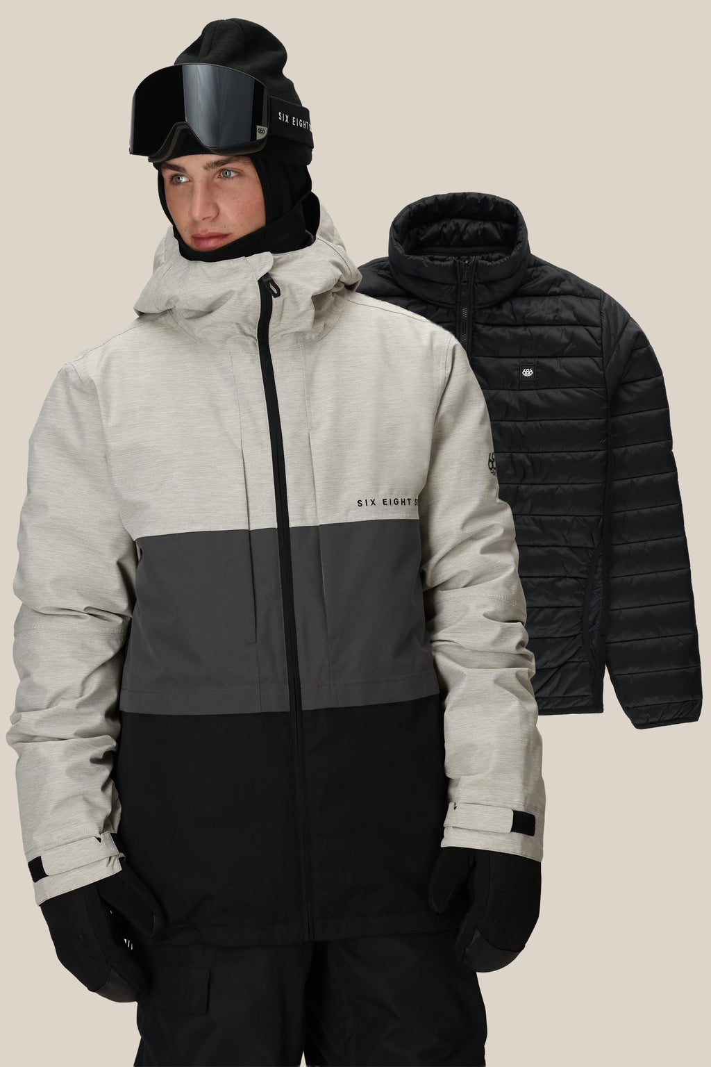 A person in a light gray and black 686 Men's SMARTY® 3-In-1 Form Jacket, black gloves, beanie, and ski goggles stands before a plain background. Behind them, the 686 jacket is displayed separately.
