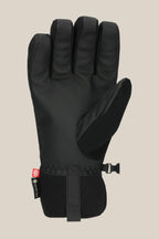 The 686 Men's GORE-TEX Linear™ Under Cuff Glove by 686 is a black insulated men’s glove with a textured palm, adjustable wrist strap, and a small fabric tag near the cuff, shown on a plain beige background.