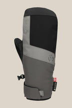 The 686 Men's GORE-TEX Linear™ Under Cuff Mitt features a black and gray color block design, black thumb, adjustable wrist strap, GORE-TEX branding on the side, and is shown against a plain light beige background.