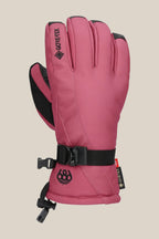 The 686 Women's GORE-TEX Linear™ Glove is a pink insulated glove with black accents, an adjustable wrist strap, small 686 logo near the cuff, reinforced fingertips, and a GORE-TEX tag for cold weather protection.