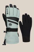 The 686 Women's GORE-TEX SMARTY® 3-In-1 Gauntlet Glove by 686 features a light gray glove with black accents, wrist strap, and zippered pocket, paired with a plain black fitted liner, displayed against a beige background.
